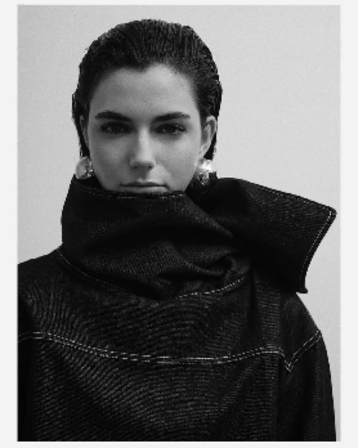 Mártusz Dorina — Black-and-white portrait with a raised dark collar