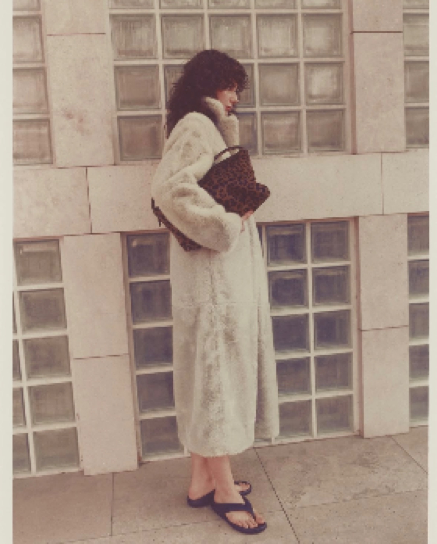 Mártusz Dorina — Side-view fashion photograph in a textured coat