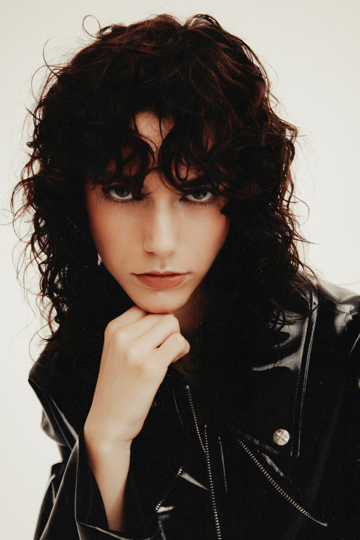 Mártusz Dorina — Close-up portrait with curly hair and a black collar